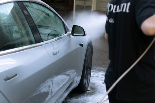 Meticulous hand washing close-up on paint