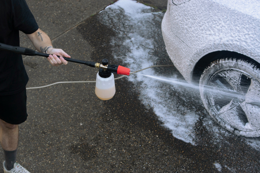 Foam pre-wash on a wheel in a client's driveway
